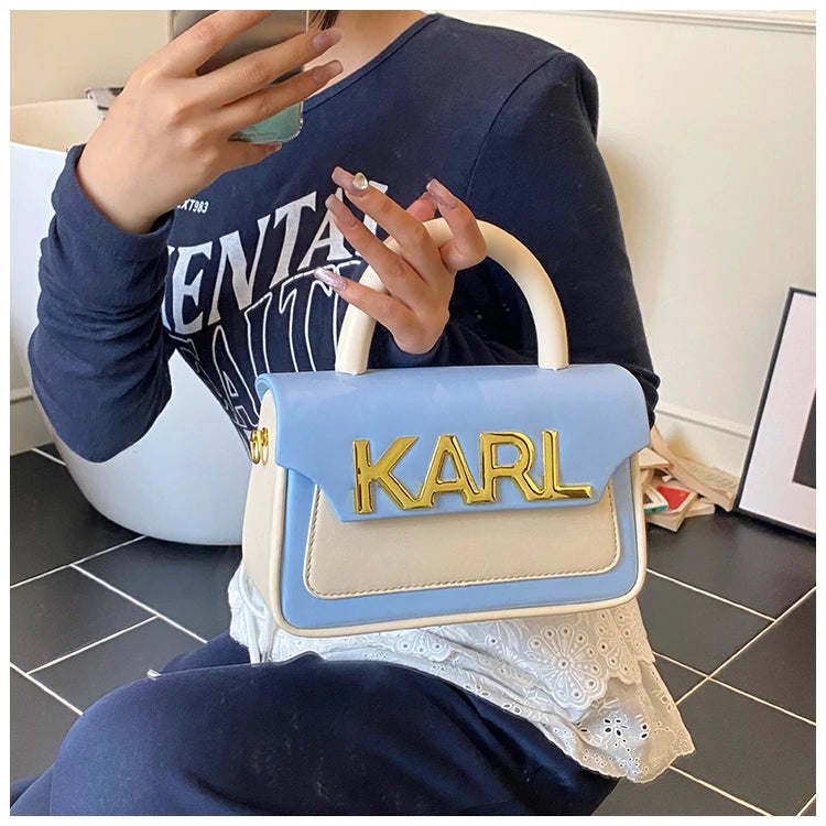 Sac à couches haut de gamme tendance avec une finition soignée et des couleurs assorties à la mode, répondant à l'esthétique des mères modernes